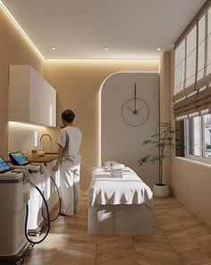 a woman in a spa room getting ready to use the machine for her skin care