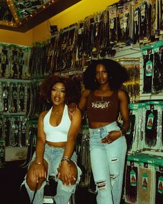 two women standing next to each other in a store