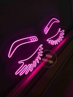 two neon lights that are on the side of a wall