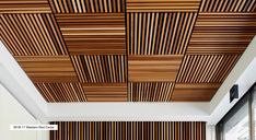 the ceiling is made out of wood and has vertical slatted panels on it