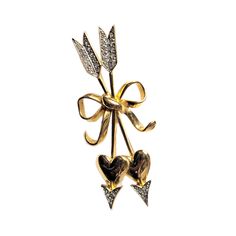 "This Joan Rivers Collection pin features Cupids arrows with rhinestone accents. The two arrows are tied with a bow and feature pave white rhinestones. The gold really glitters in this vintage brooch. This piece is marked \"Joan Rivers\" on the back and has a c-clasp closure. It is as bright and lovely as the day it was made. The pin measures approximately 3 inches by 1 1/4 inches and will SHIP FREE USPS First Class Mail - usually 3-7 business days (domestic orders only) If you would like faster Cupids Arrow, Vintage Wrapping Paper, Jewelry Heart, Heart Pin, Joan Rivers, White Rhinestone, Vintage Brooch, Heart Jewelry, Vintage Brooches