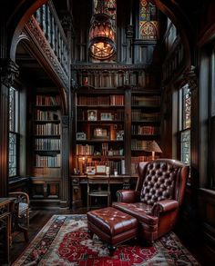 a chair in front of a book shelf filled with books