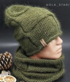 a knitted hat and scarf on top of a mannequin head