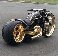 a black and gold motorcycle parked on the street