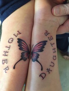 two people with matching tattoos on their arms, one has a butterfly and the other has words