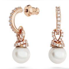 For This Beautiful Design From The Originally Family, Classic Pearl Earrings Have Been Reimagined With Swarovski's Savoir-Faire. The Result Is A Modern Pair Of Earrings Featuring Rose Gold-Tone Plated Hoops And Twists Of Shimmering Pav Holding A Luminous Swarovski Crystal Pearl. Choose This Pair For Classic Glamour And A Subtle Glow. Collection: Originally Size: 7/8 X 1/4 Inch Material: Crystal Pearl, Rose Gold-Tone Plated, Zirconia Color: White Weight (Individual Piece): 0.07 Oz Ears Piercing, Classic Pearl Earrings, Metal Post, Classic Glamour, Doe Eyes, Swarovski Earrings, Swarovski Jewelry, Single Earring, Bangles Jewelry