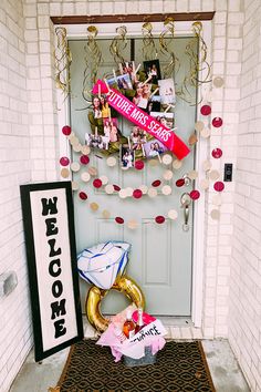 a front door decorated with decorations and photos for someone's 50th birthday or other special occasion