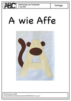 a paper cut out of the letter a with a monkey on it's face