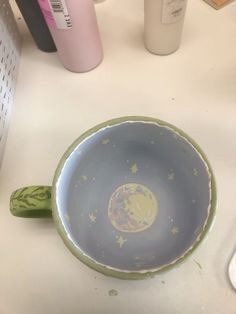 a blue bowl sitting on top of a white counter