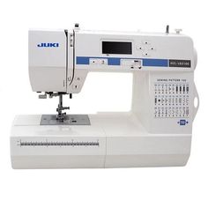 the juki sewing machine is white with blue trimmings on it's side