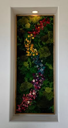 a painting on the wall with flowers in it