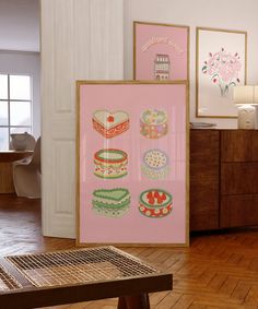 there are pictures on the wall in this room and one is pink with green designs