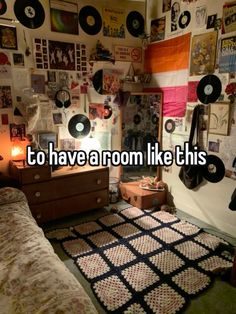 a room with records on the wall and a bed in front of it that says to have a room like this