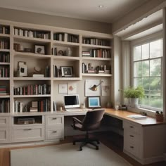 a home office with bookshelves and desk in front of a large window,