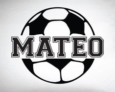 a soccer ball with the word mateo written in black and white on a gray background