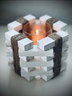 a candle holder made out of wooden blocks