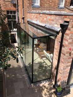 an outside view of a brick building with glass doors