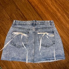 Never Worn Mini Skirt Denim Blue Denim Skort For Summer, Spring Denim Blue Skort, Spring Denim Skort, Denim Skirt Bottoms For Day Out, Denim Mini Skort For Spring, Spring Denim Mini Skort, High Rise Denim Skort For Day Out, Blue Cutoff Skort For Spring, Spring Denim Blue Denim Skort