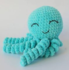 an octopus stuffed animal sitting on top of a table