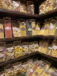 many different types of pasta are on display in a grocery store, and there is no image here to provide a caption for