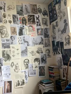 a room with many pictures on the wall