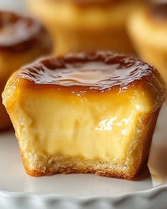 a close up of a pastry on a plate with other pastries in the background