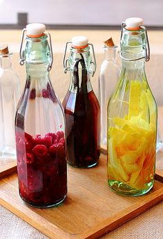 there are many different types of food in glass bottles on the table and below them is a collage of pictures