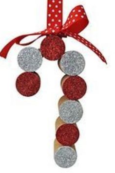 an ornament with red and silver balls hanging from it's side on a white background