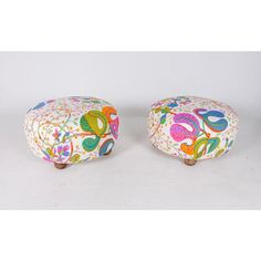 two colorful foot stools sitting next to each other