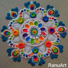 this is an image of a colorful design on the floor with beads and threads