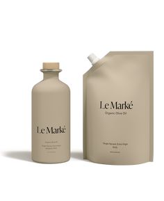 a bottle of le marke organic olive oil next to a bag on a white background