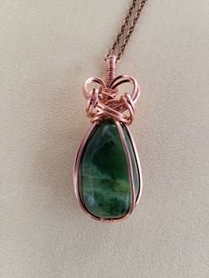 Pure copper wire wrapped Nephrite Jade pendant on 22 inch copper chain. Nephrite Jade is a very lucky stone that can transmute negative energy into positive. The wearer attracts prosperity and a sense of peace. Lucky Stone, Jade Gemstone, Wrapped Necklace, Nephrite Jade, Wire Wrapped Necklace, Jade Jewelry, Jade Pendant