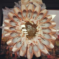 there is a wreath made out of ballet shoes