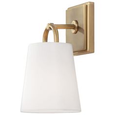 a wall light with a white shade on it