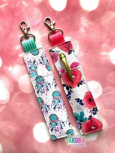 two key fobs with flowers on them