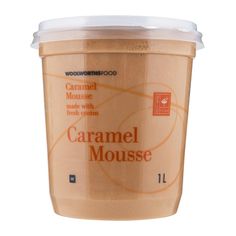 a cup of caramel mousse on a white background