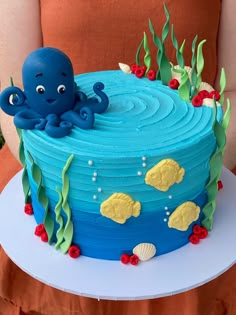 a blue cake with an octopus on top