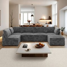 a living room filled with furniture and a white coffee table