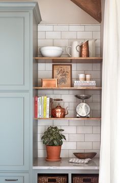 an image of a shelf with books and other items on it for $ 15 off