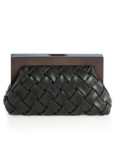 Carry your essentials in style with Shiraleah's Charlotte Frame Clutch. This handheld purse features a vegan leather woven texture and a wood top handle, adding a sophisticated edge to this chic silhouette. Measuring L 11" × W 4" × H 7.25", and equipped with a magnetic frame closure and inner slip pocket, the Charlotte Frame Clutch is the perfect addition to your favorite outfit. Pair with other items from Shiraleah to complete your look! Color: Black L 11" × W 4" × H 7.25" Woven Pu And Wood Mag Spa Wraps, Magnetic Frame, Magnetic Frames, Accessories Display, Clutch Black, Woven Texture, Leather Weaving, Framed Gifts, Zip Pouch