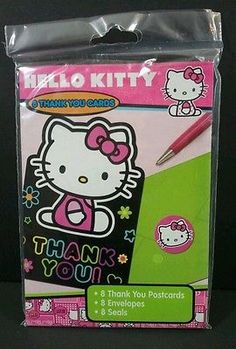 a hello kitty thank you note pad and pen set in its package with the box