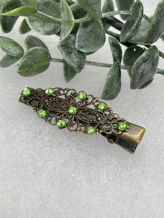 Green crystal rhinestone 2.5” alligator clip Antique vintage style bridal Wedding shower sweet 16 birthday princess bridesmaid hair accessory This item is made by a Hairdazzel The Hairdazzzel Accessory brings out the beauty and style within. Handcrafted from high-quality beads crystal ,Rhinestone every piece from the hairdazzzel hair Jewelry collection is designed to emphasize and accentuate your individual personality. More than something you’ll wear once and forget, your unique hair Jewelry ha Green And Gold Hair Accessories, Vintage Formal Adjustable Hair Accessories, Green Hair Clips, Emerald Green Hair Clips, Vintage Green Clip-on Jewelry, Retro Bridal, Bridesmaid Hair Accessories, Hair Accessories Collection, Handmade Hair Accessories