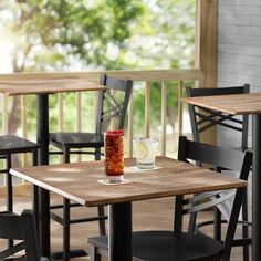 an empty table and chairs in a restaurant