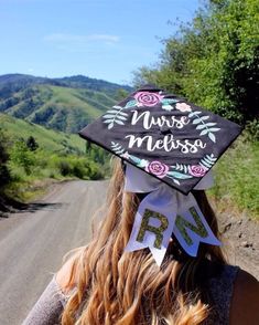 a woman wearing a graduation cap that says nurse melissa on it's side