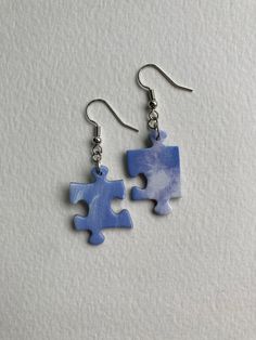 A unique earring made from upcycled orphaned puzzle pieces. One-of-a-kind find! Puzzle Earrings, Puzzle Piece Art, Puzzle Piece Crafts, Upcycled Earrings, Unique Earring, Puzzle Jewelry, Scrabble Tiles, Beaded Jewelry Designs, Puzzle Piece