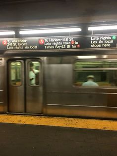 a subway train with its doors open at night