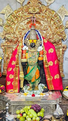 the statue of lord rama is surrounded by fruits