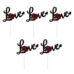 three cake toppers with roses on them that say live, love, and laugh