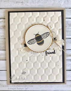 a card with a bee on it and the words friend written in black, white and gold