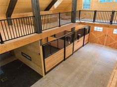 an empty loft with wooden walls and flooring